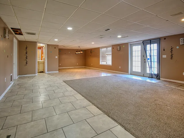 a view of an empty room with windows