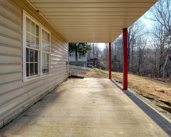 a view of a backyard with a patio