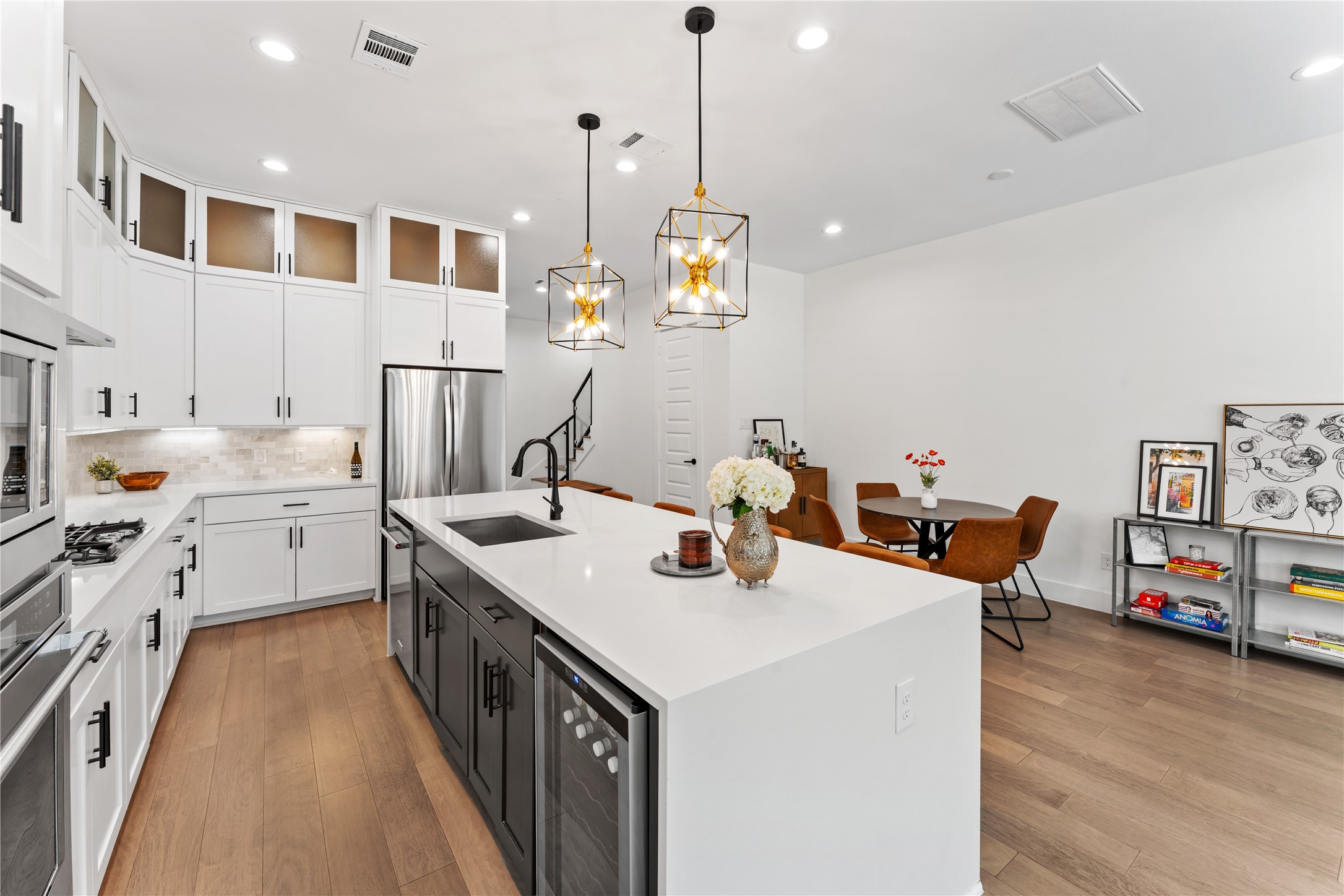 820 East 24th Street Houston, TX 77009 - Photo 1 of 34 a kitchen that has a lot of cabinets and wooden floor