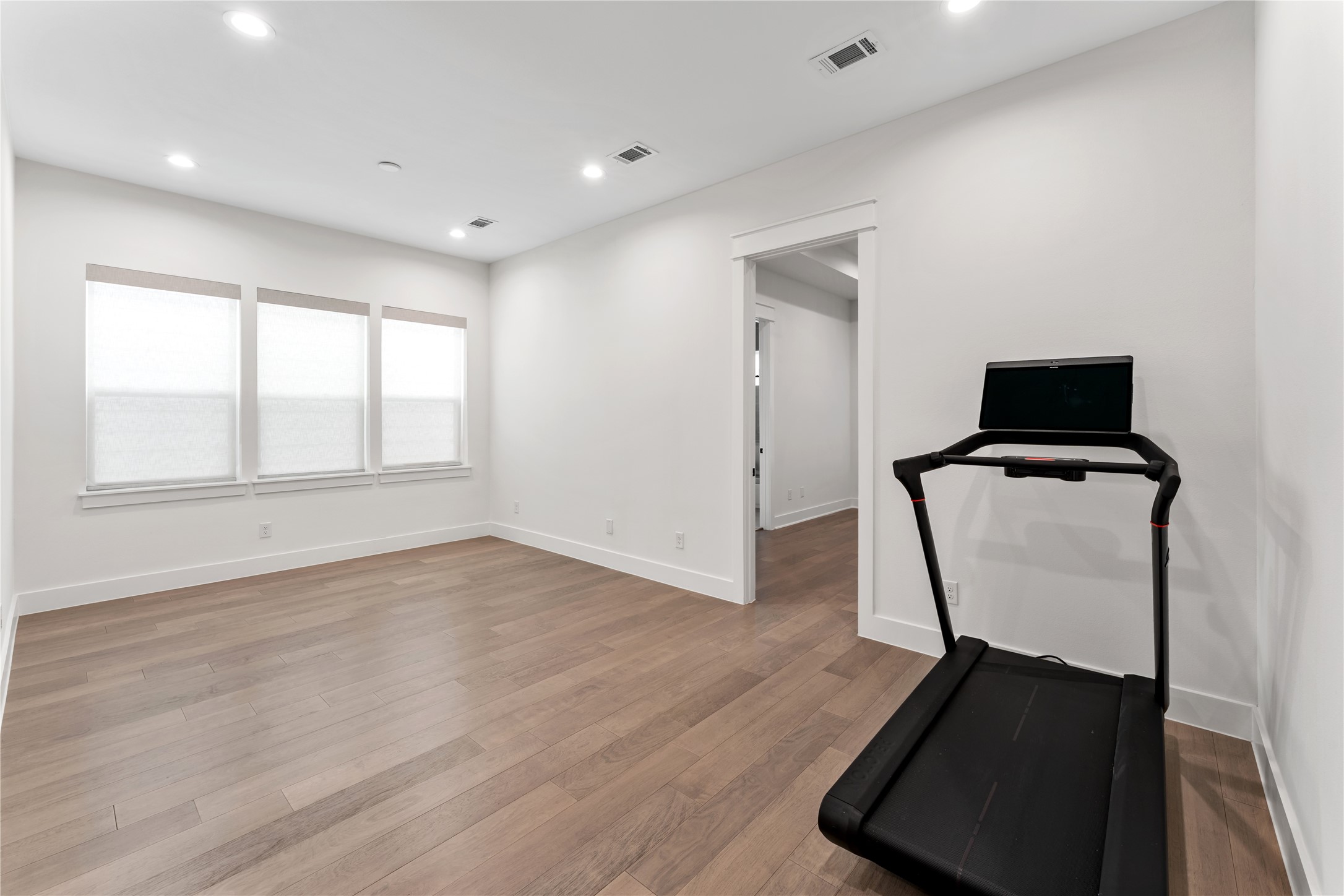 820 East 24th Street Houston, TX 77009 - Photo 27 of 34 A versatile upstairs gameroom offers endless possibilities for entertainment, relaxation, or a second living area. The spacious layout easily adapts to your lifestyle needs. Ideal for movie nights, play space, or a secondary lounge.