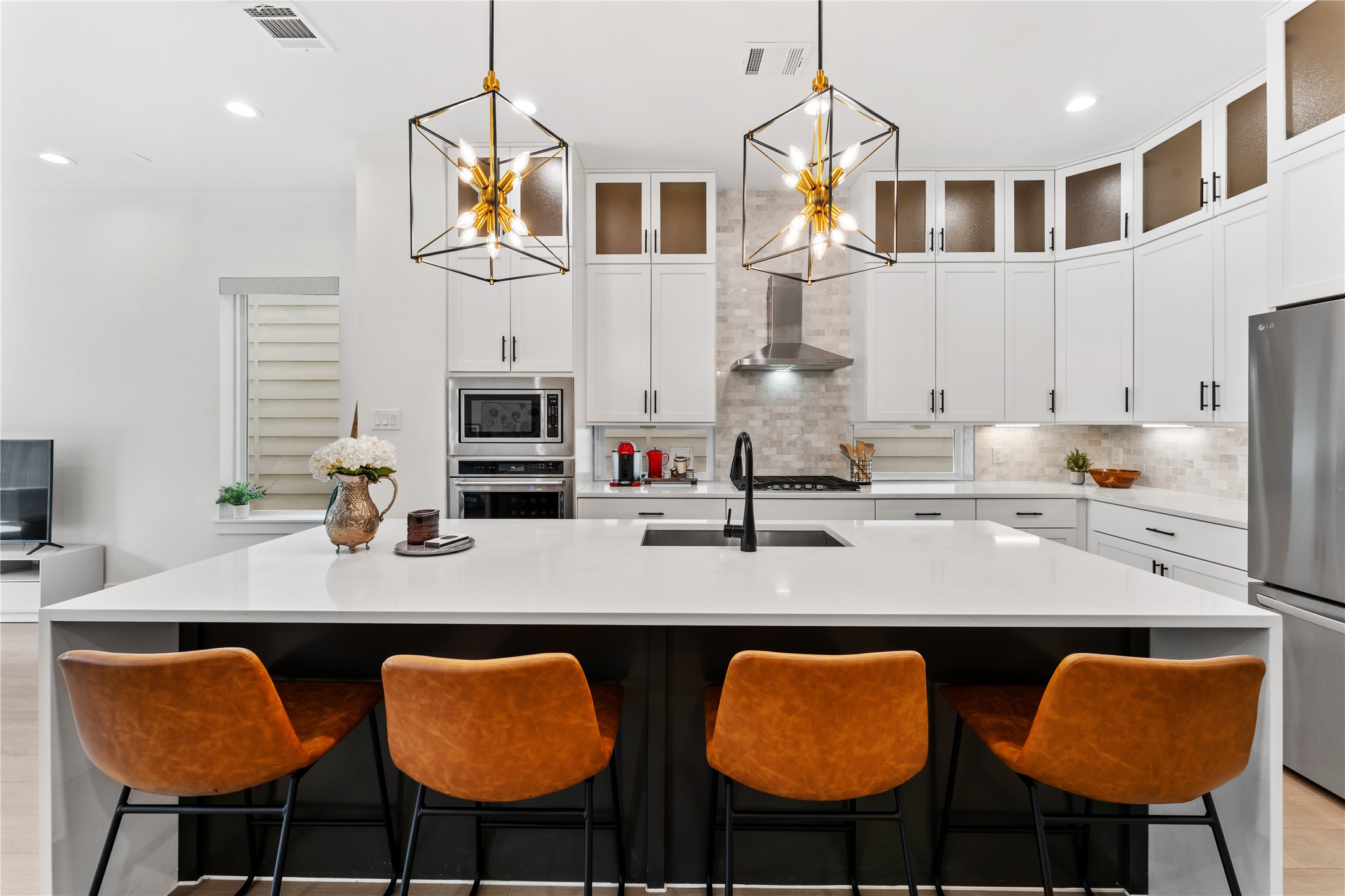 820 East 24th Street Houston, TX 77009 - Photo 7 of 34 a kitchen with stainless steel appliances granite countertop a table chairs stove and sink