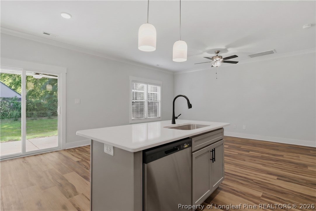 3931 Hamilton Street Hope Mills, NC 28348 - Photo 24 of 50 a kitchen that has a sink a stove and a window