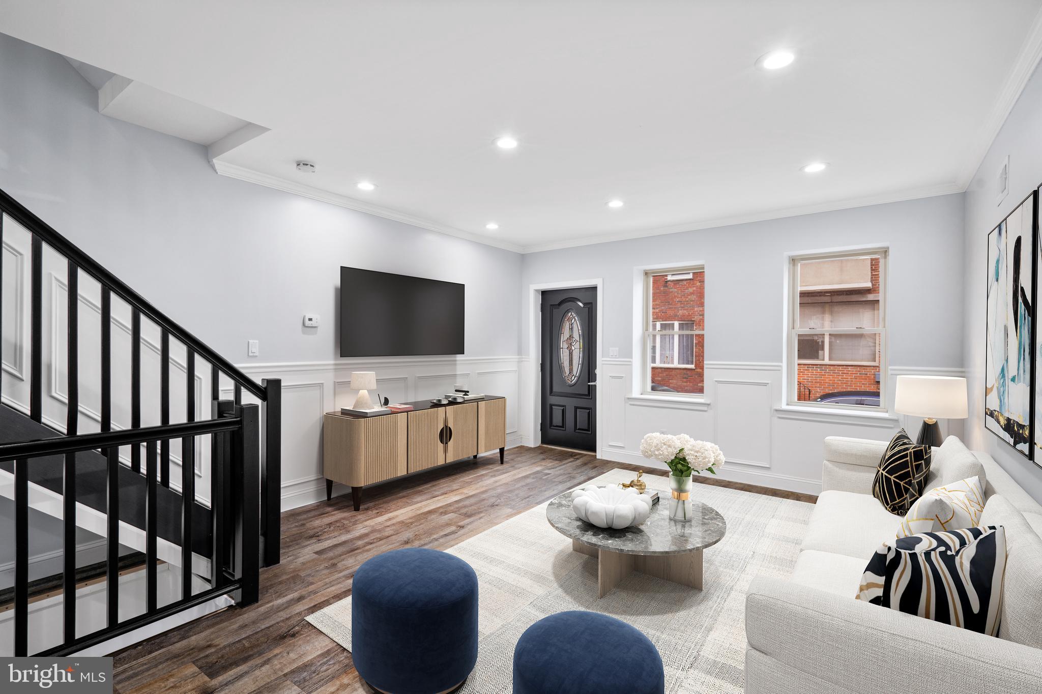 1605 Manton Street Philadelphia, PA 19146 - Photo 1 of 21 a living room with furniture and a flat screen tv