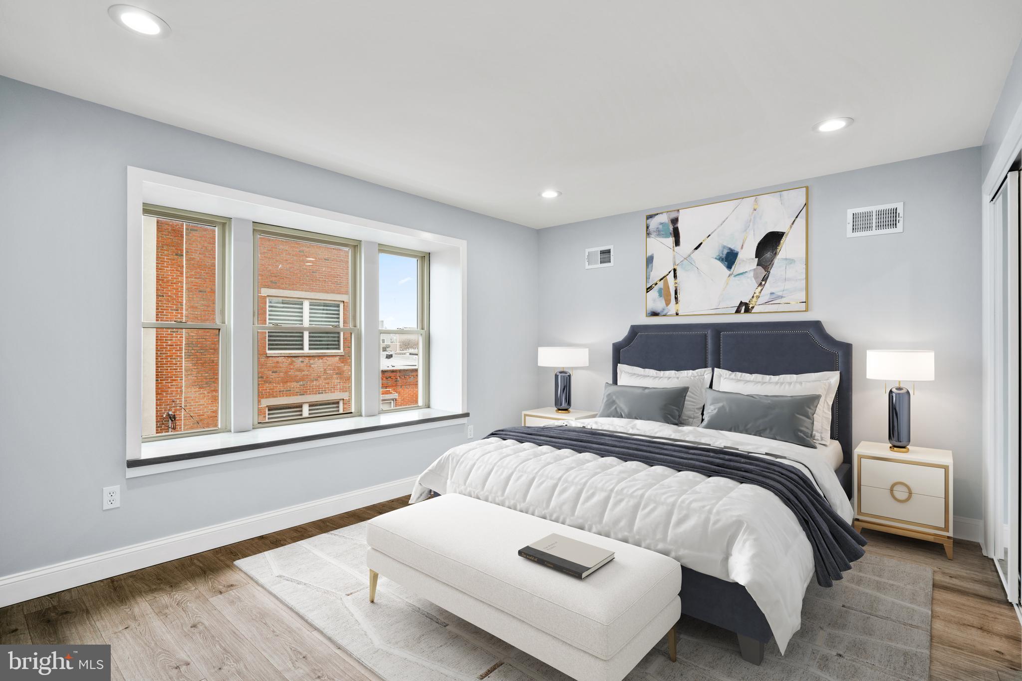 1605 Manton Street Philadelphia, PA 19146 - Photo 11 of 21 a bedroom with a large bed and a window