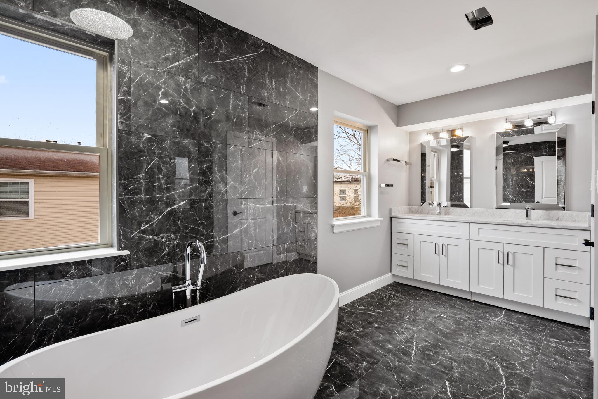 1605 Manton Street Philadelphia, PA 19146 - Photo 12 of 21 a bathroom with a tub sink and mirror