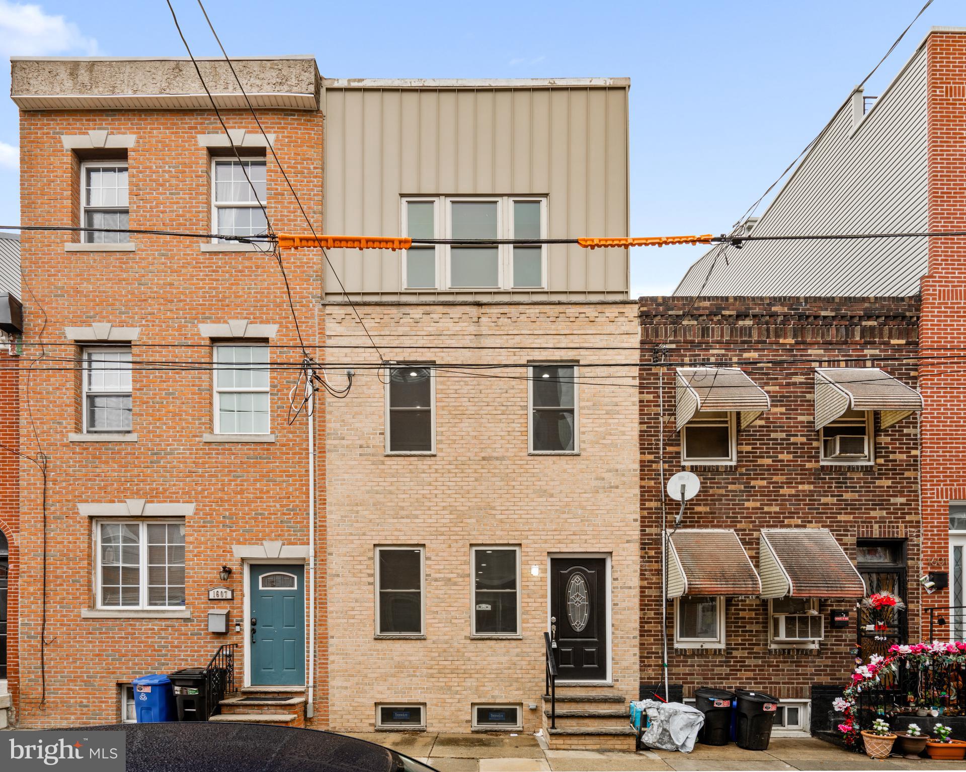 1605 Manton Street Philadelphia, PA 19146 - Photo 20 of 21 a front view of a building with glass windows