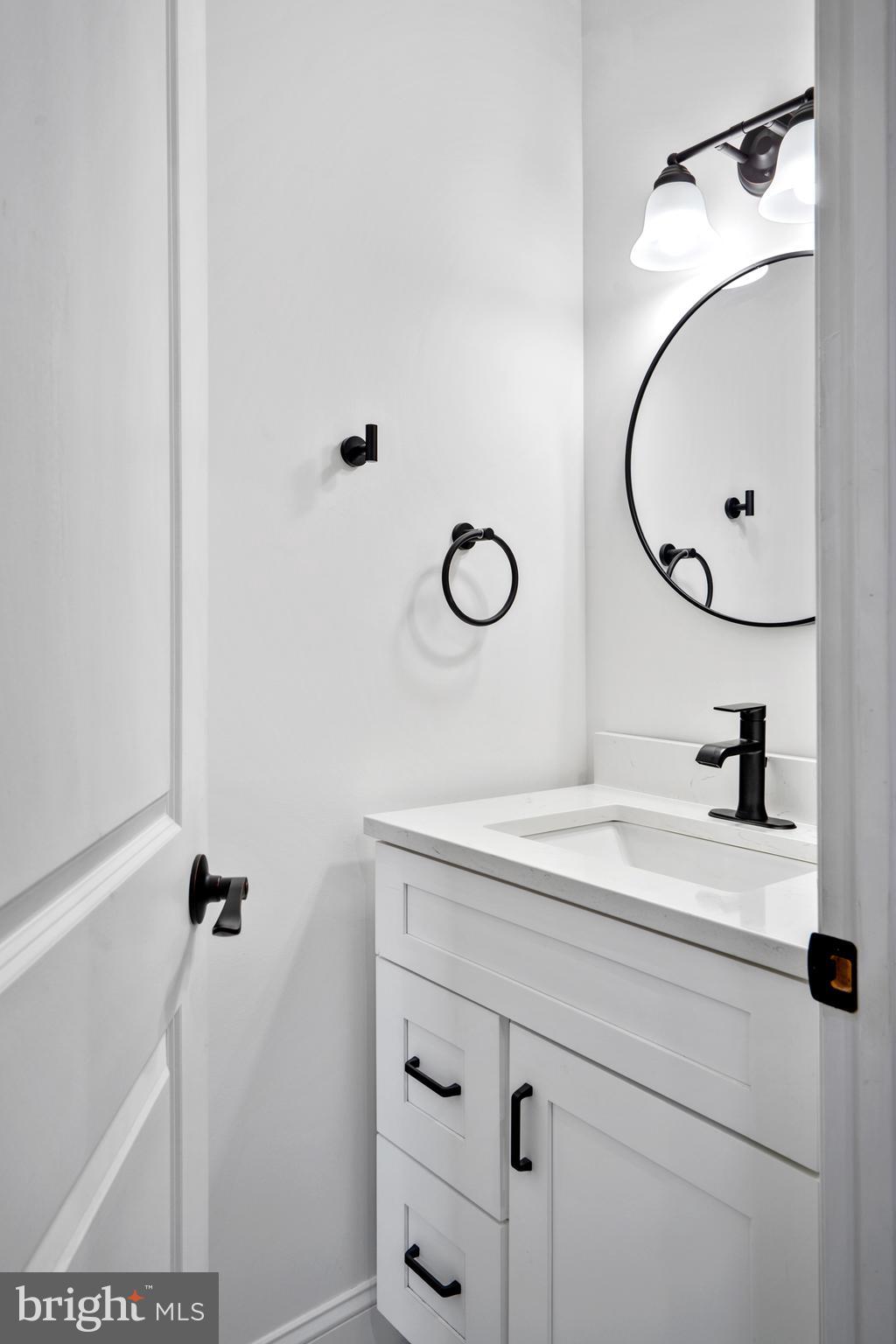 1605 Manton Street Philadelphia, PA 19146 - Photo 4 of 21 a bathroom with a sink and a mirror