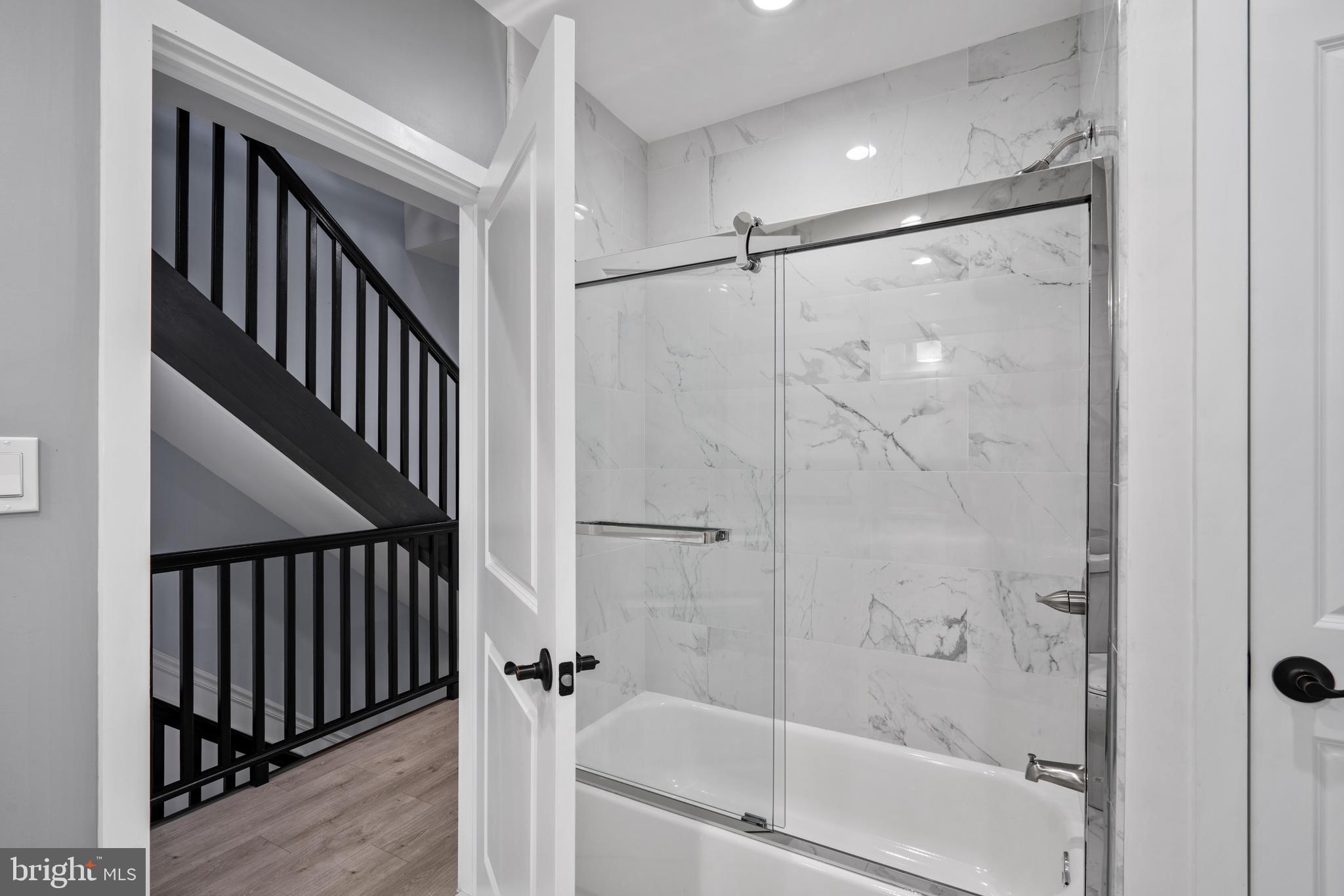 1605 Manton Street Philadelphia, PA 19146 - Photo 8 of 21 a bathroom with a shower and a glass door
