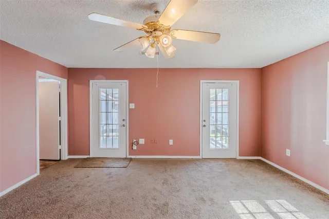 a view of a hallway with seating area