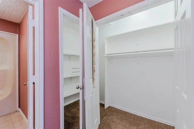 a bathroom with a bathtub and toilet