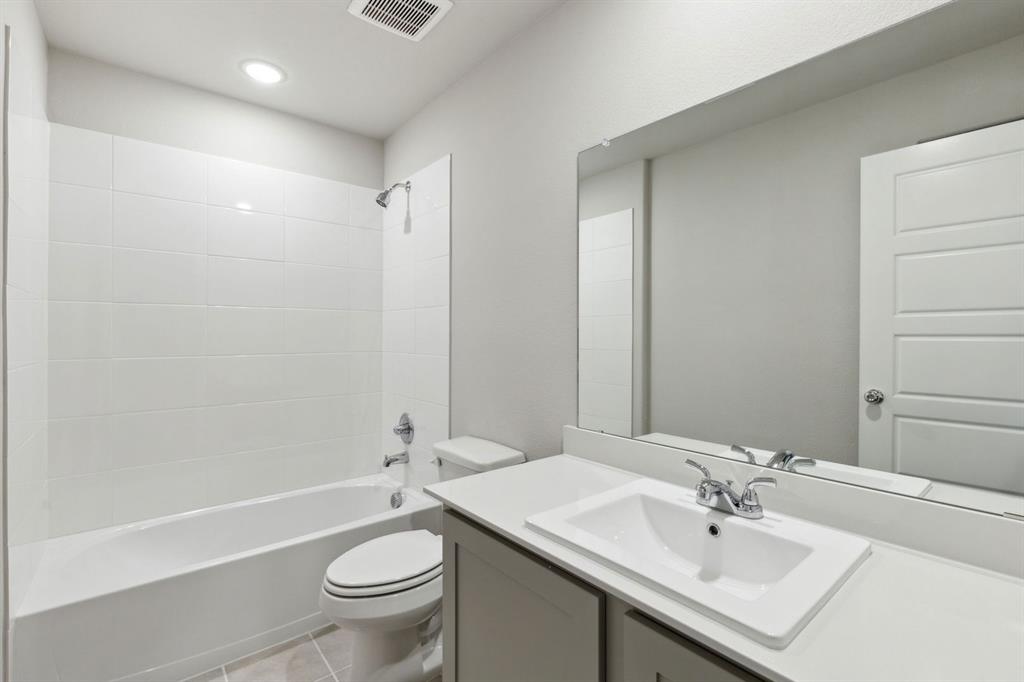 506 River Rdg Drive McKinney, TX 75071 - Photo 25 of 35 a bathroom with a sink a toilet and shower