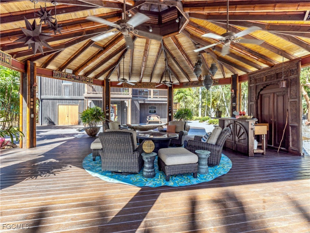 1000 Cayo Costa Boca Grande, FL 33921 - Photo 12 of 47 a living room with patio furniture and a wooden floor
