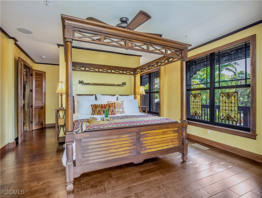 1000 Cayo Costa Boca Grande, FL 33921 - Photo 28 of 47 a room with a bed and a large window with balcony view