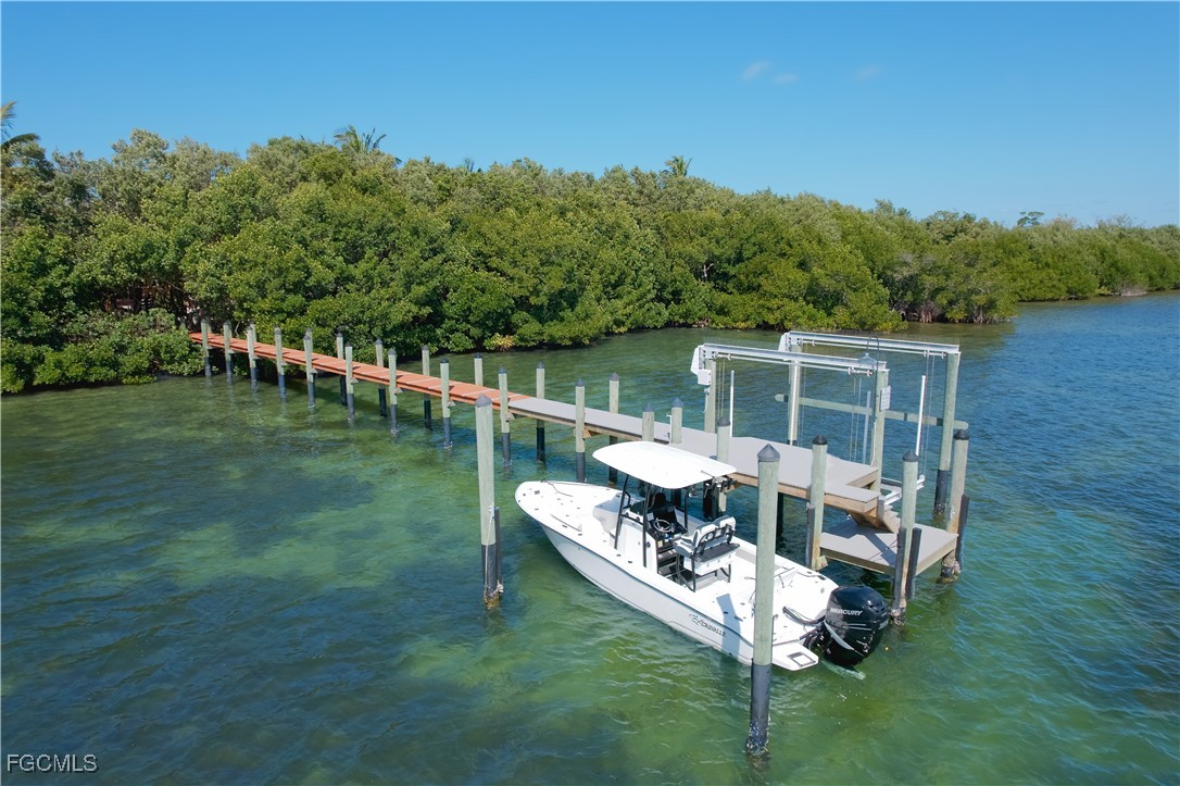 1000 Cayo Costa Boca Grande, FL 33921 - Photo 7 of 47 a balcony with couple of table and chairs