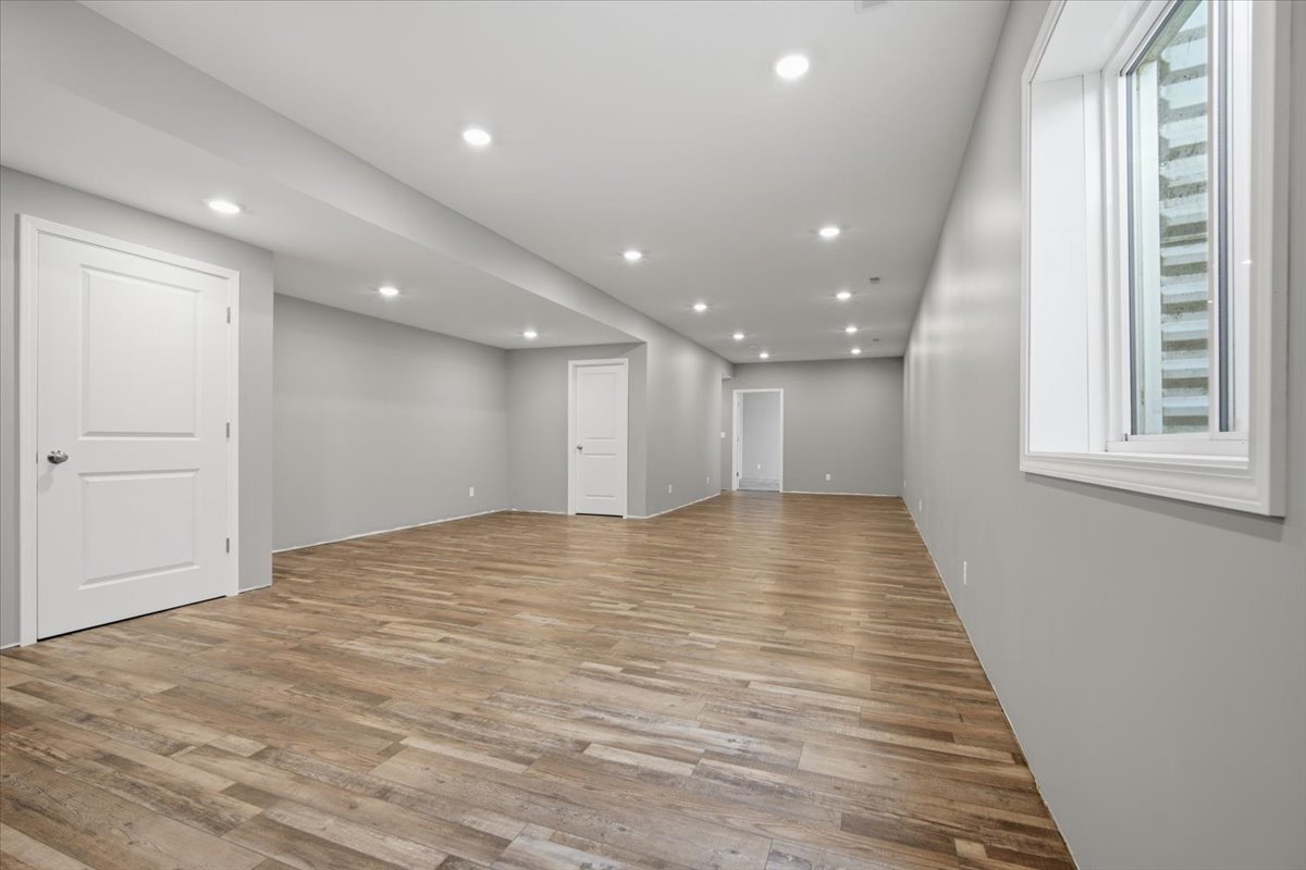 1813 Partridge Point Normal, IL 61761 - Photo 23 of 37 a view of an empty room with wooden floor and a window