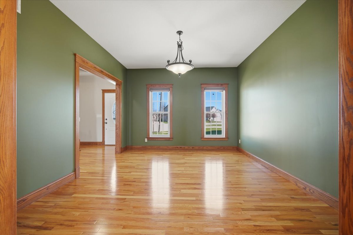1813 Partridge Point Normal, IL 61761 - Photo 5 of 37 a view of an empty room with window and wooden floor