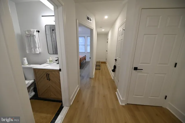 a bathroom with a sink a mirror and shower