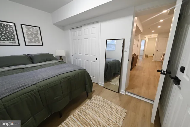 a bedroom with a bed and a walk in closet