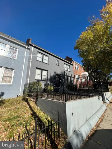 a view of a house with a snow in the background