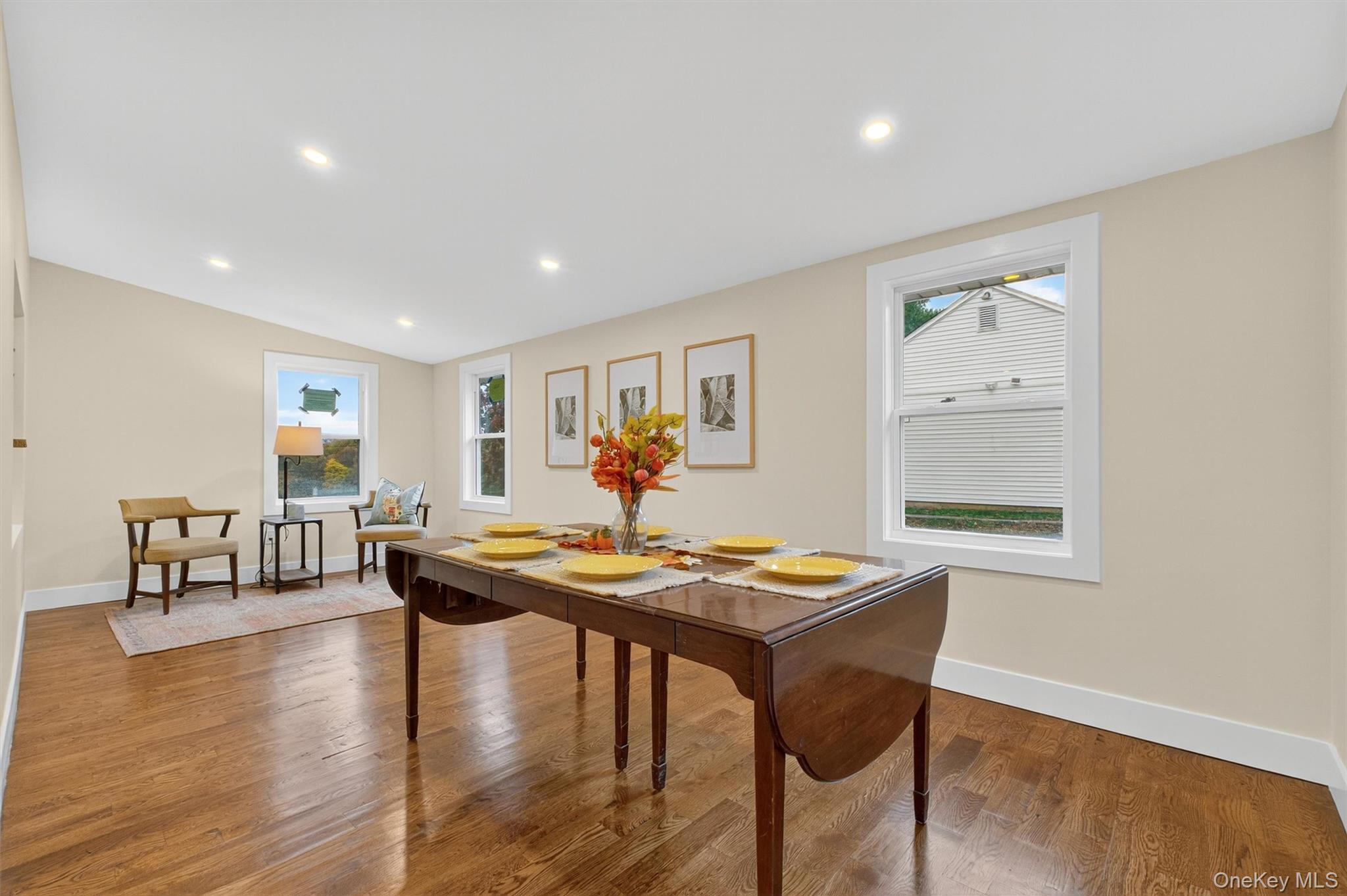86 Vassar Road Poughkeepsie, NY 12603 - Photo 13 of 32 a living room with dining table and wooden floor
