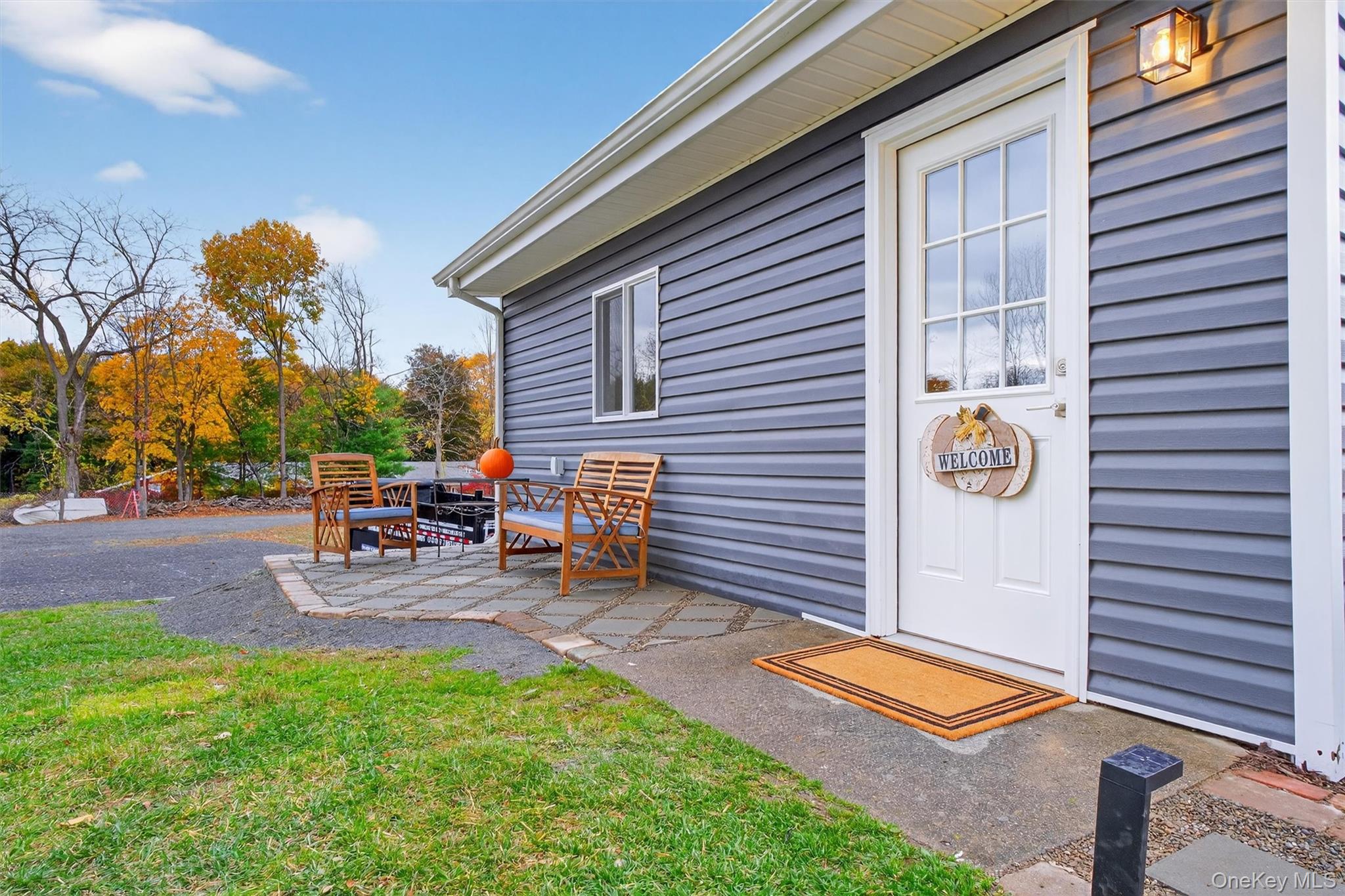 86 Vassar Road Poughkeepsie, NY 12603 - Photo 2 of 32 a view of a backyard with chairs and a patio