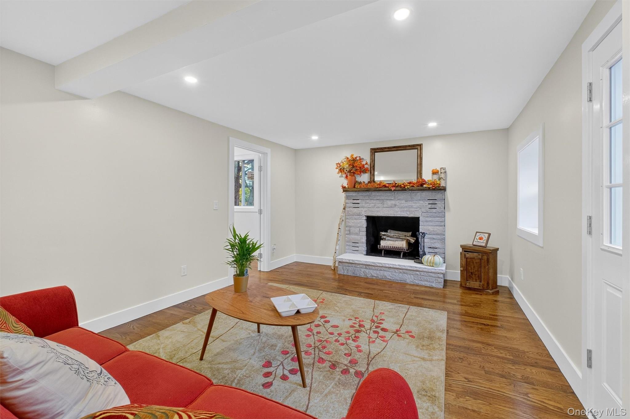 86 Vassar Road Poughkeepsie, NY 12603 - Photo 3 of 32 a living room with furniture and a fireplace