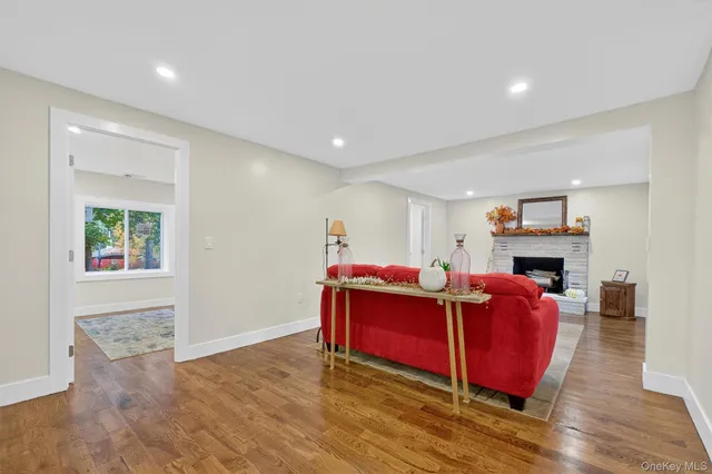 a living room with furniture windows and a fireplace