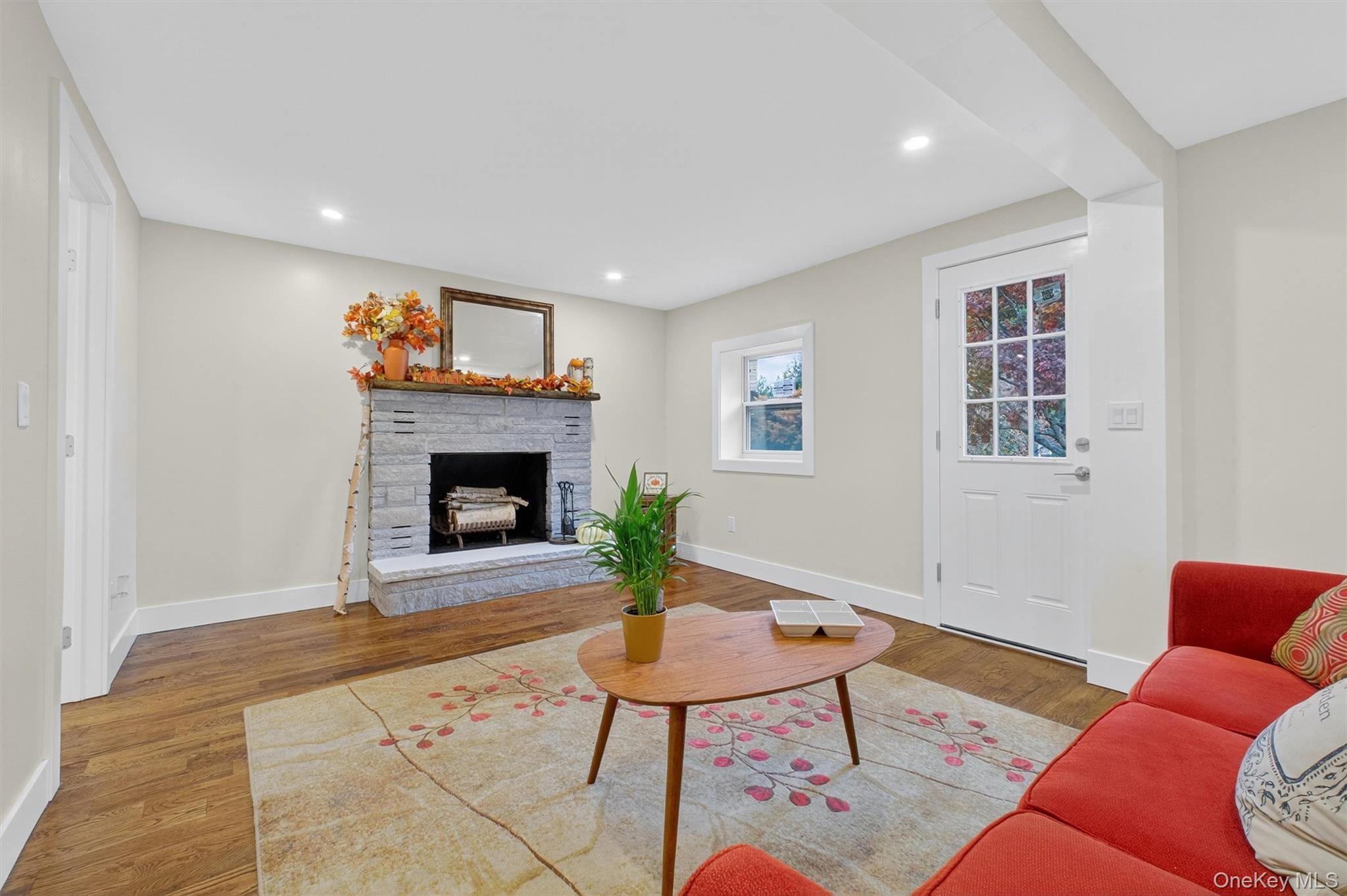 86 Vassar Road Poughkeepsie, NY 12603 - Photo 5 of 32 a living room with furniture and a fireplace