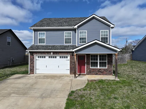 front view of a house with a yard