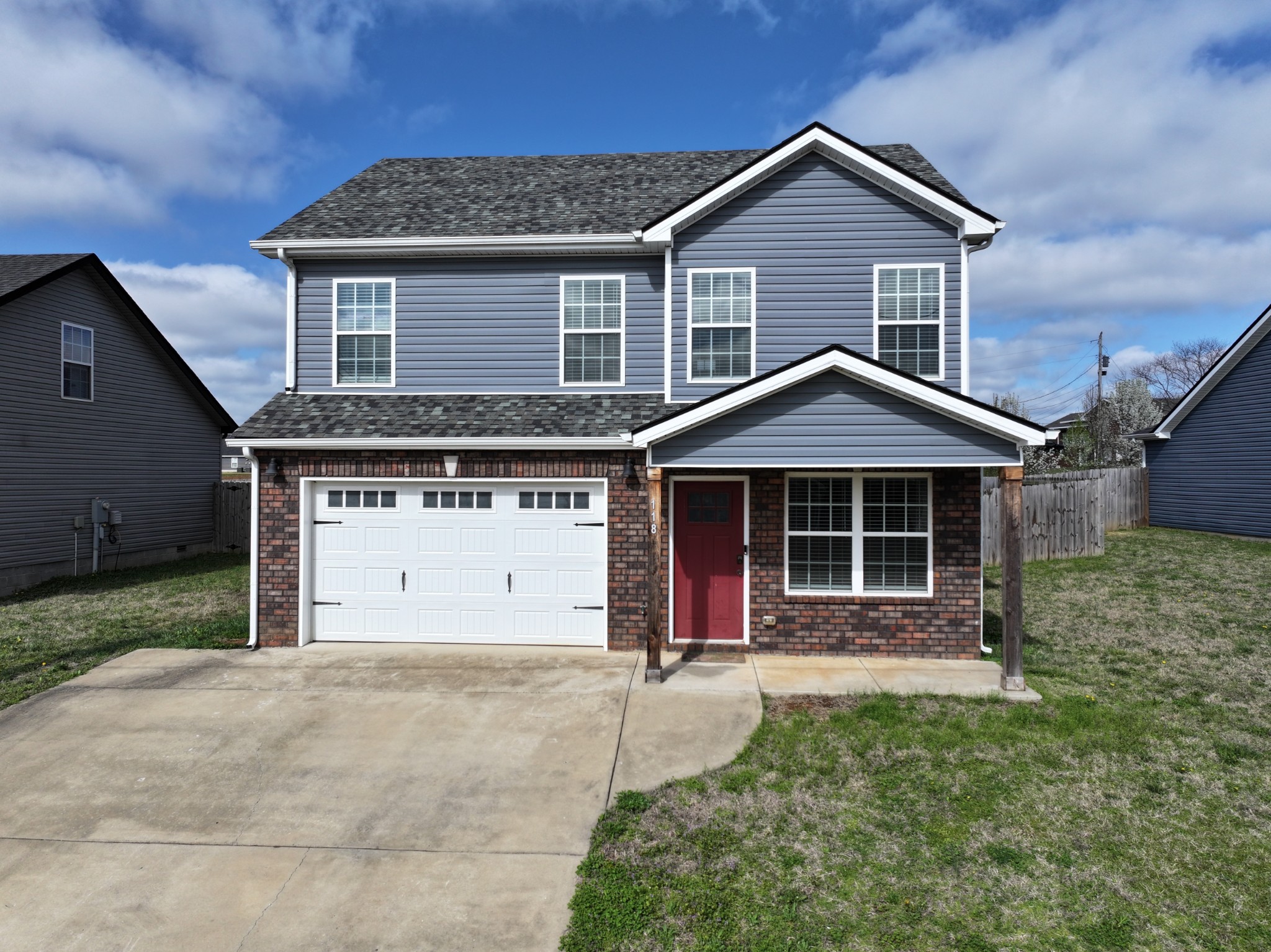 front view of a house with a yard