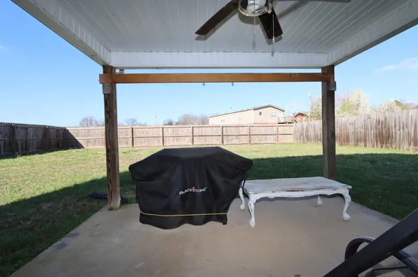 a view of a two chairs in the patio