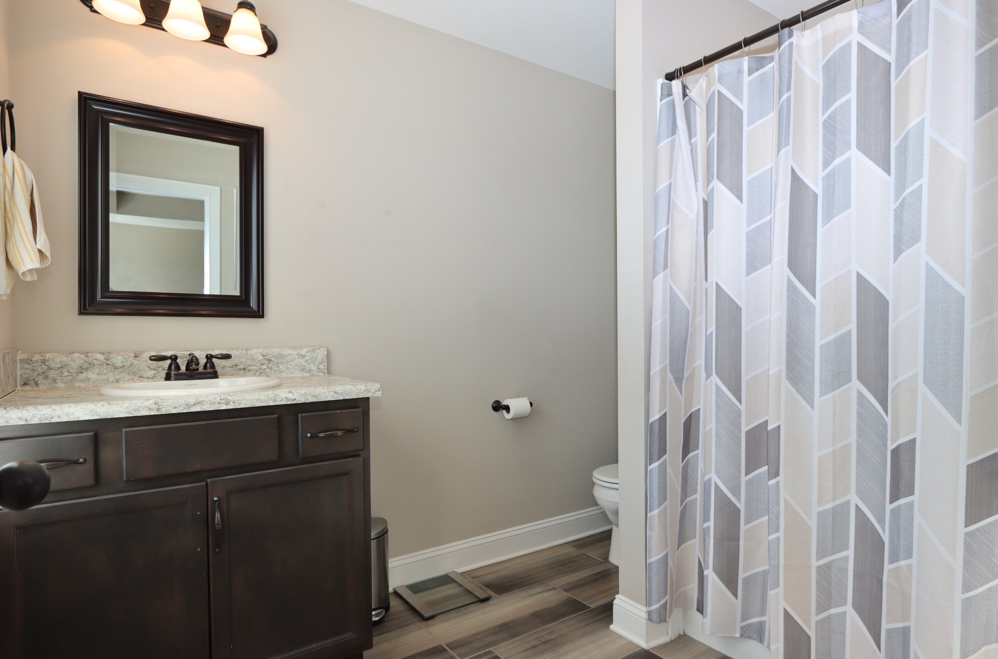 118 Ambridge Street Oak Grove, KY 42262 - Photo 10 of 14 a bathroom with a sink and mirror with toilet