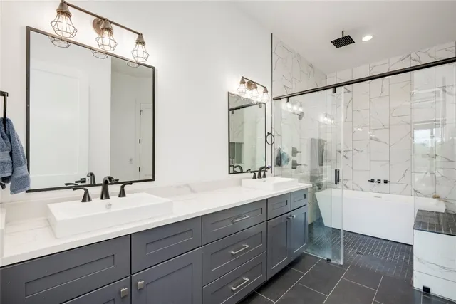 a bathroom with a double vanity sink mirror double and shower
