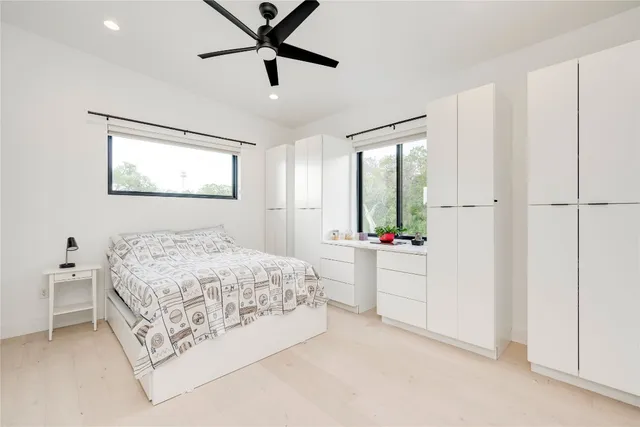 a bedroom with a bed and a window