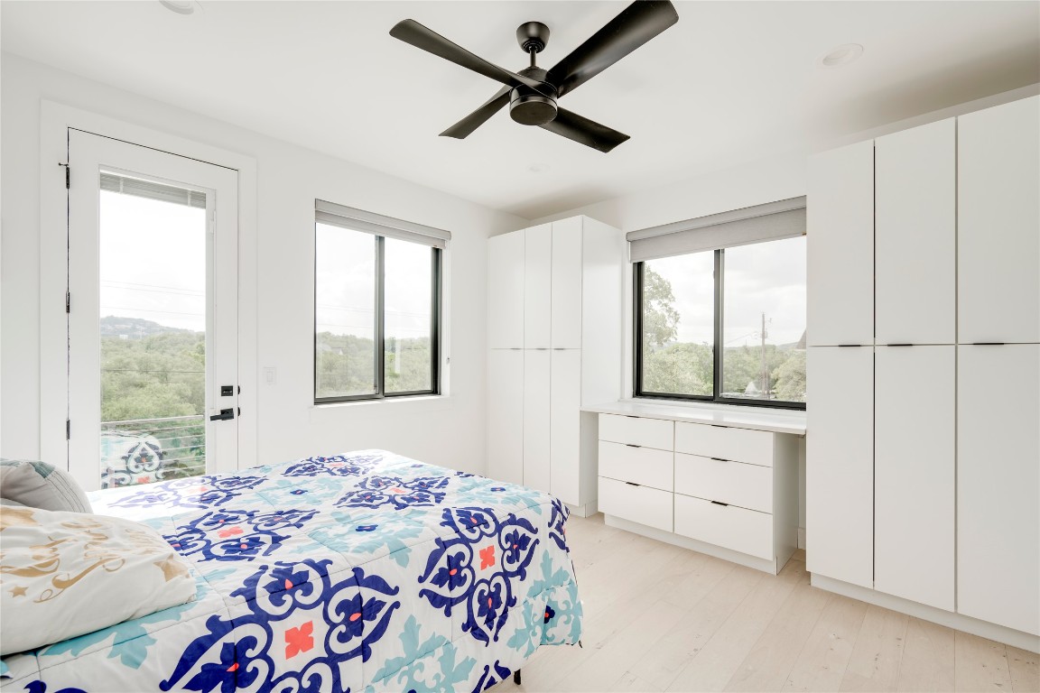 13209 Mansfield Drive Austin, TX 78732 - Photo 15 of 27 a bedroom with a bed and a window