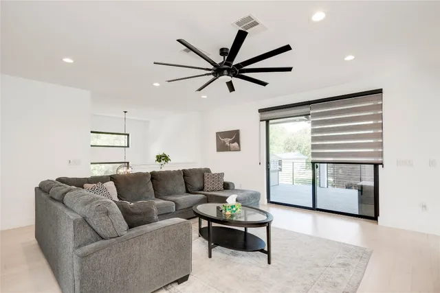a living room with furniture and a rug