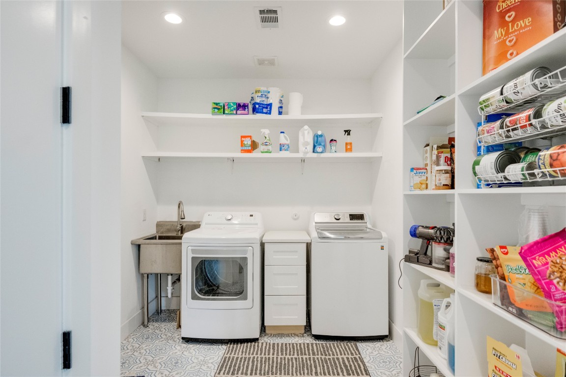 13209 Mansfield Drive Austin, TX 78732 - Photo 23 of 27 a utility room with fridge dryer and washer