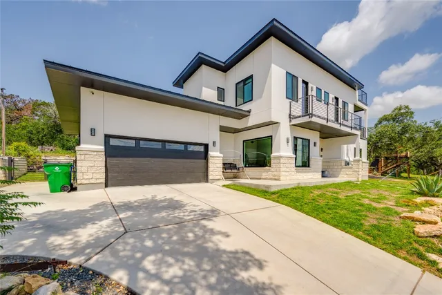a front view of a house with yard