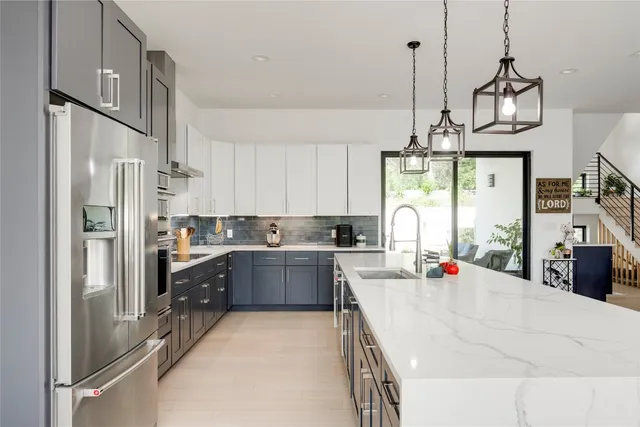 a kitchen with refrigerator cabinets and furniture