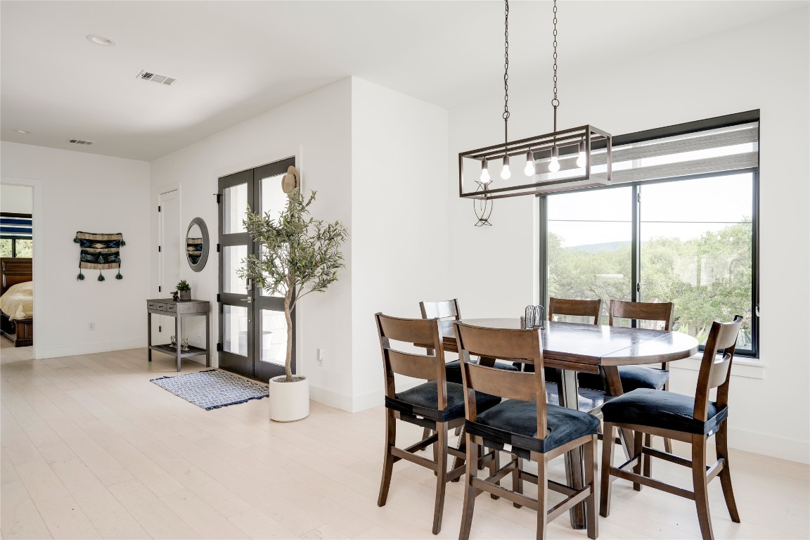 13209 Mansfield Drive Austin, TX 78732 - Photo 7 of 27 a view of a dining room with furniture window and outside view