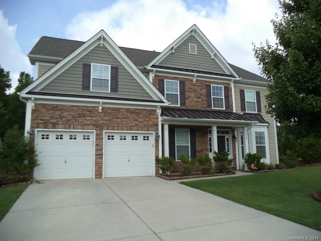 831 Solandra Way, Unit 494 Tega Cay, SC 29708 - Photo 1 of 1 a front view of a house with a yard