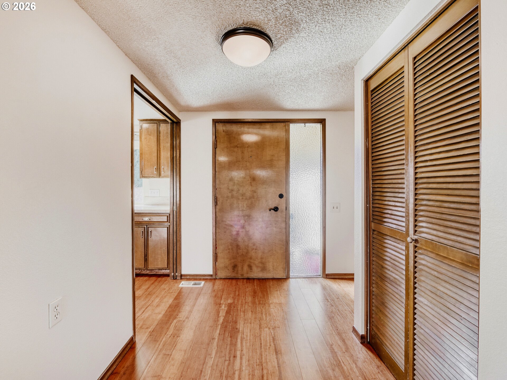 16588 Southwest Matador Lane Portland, OR 97224 - Photo 16 of 28 a view of a room with wooden floor and front door