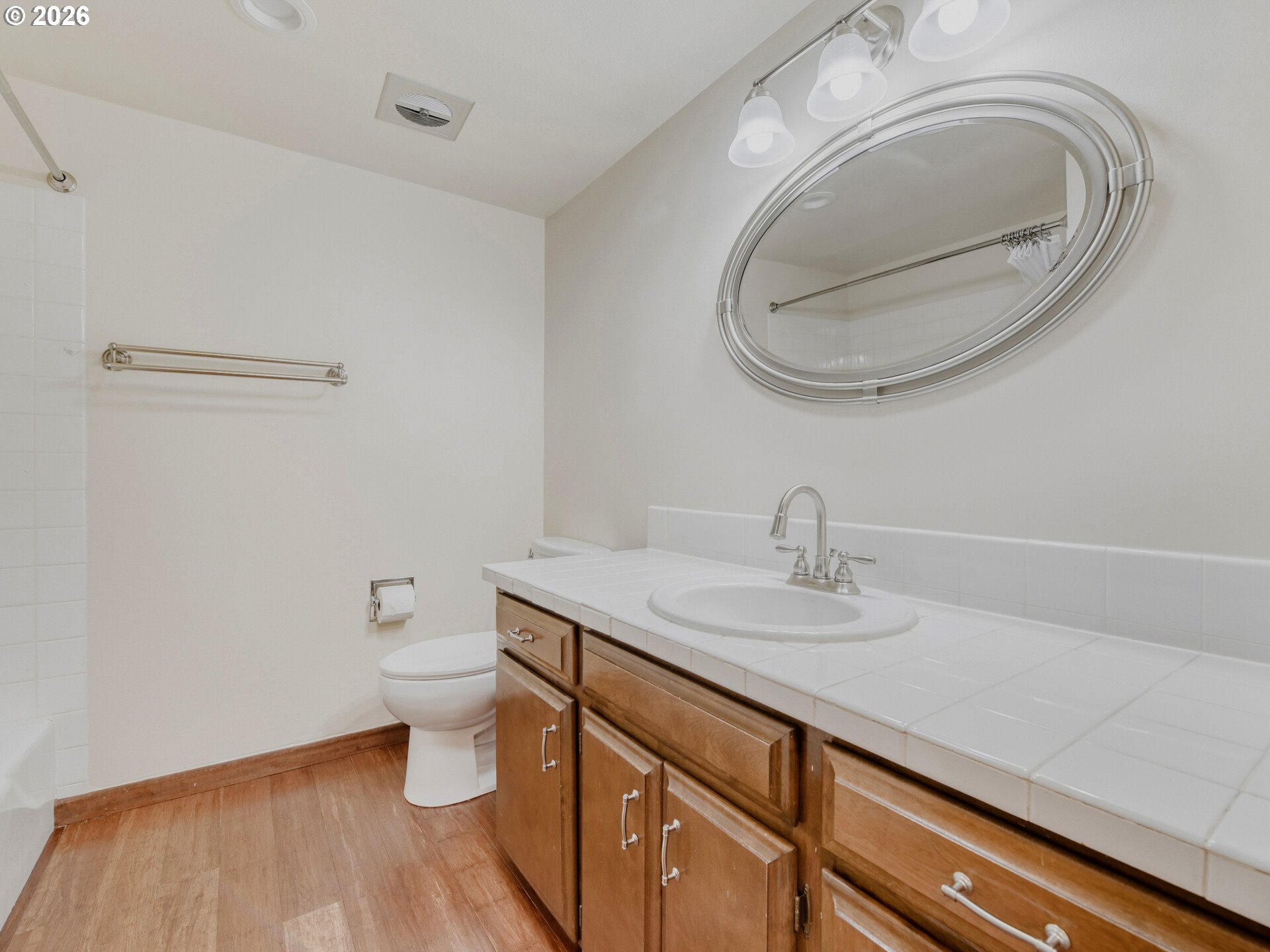 16588 Southwest Matador Lane Portland, OR 97224 - Photo 24 of 28 a bathroom with a sink and a mirror