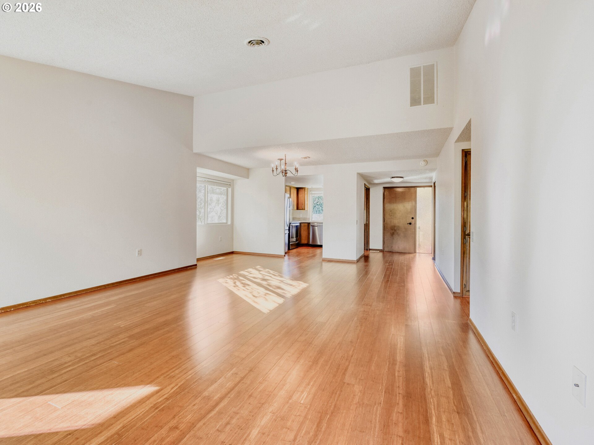 16588 Southwest Matador Lane Portland, OR 97224 - Photo 9 of 28 a view of a big room with wooden floor and windows