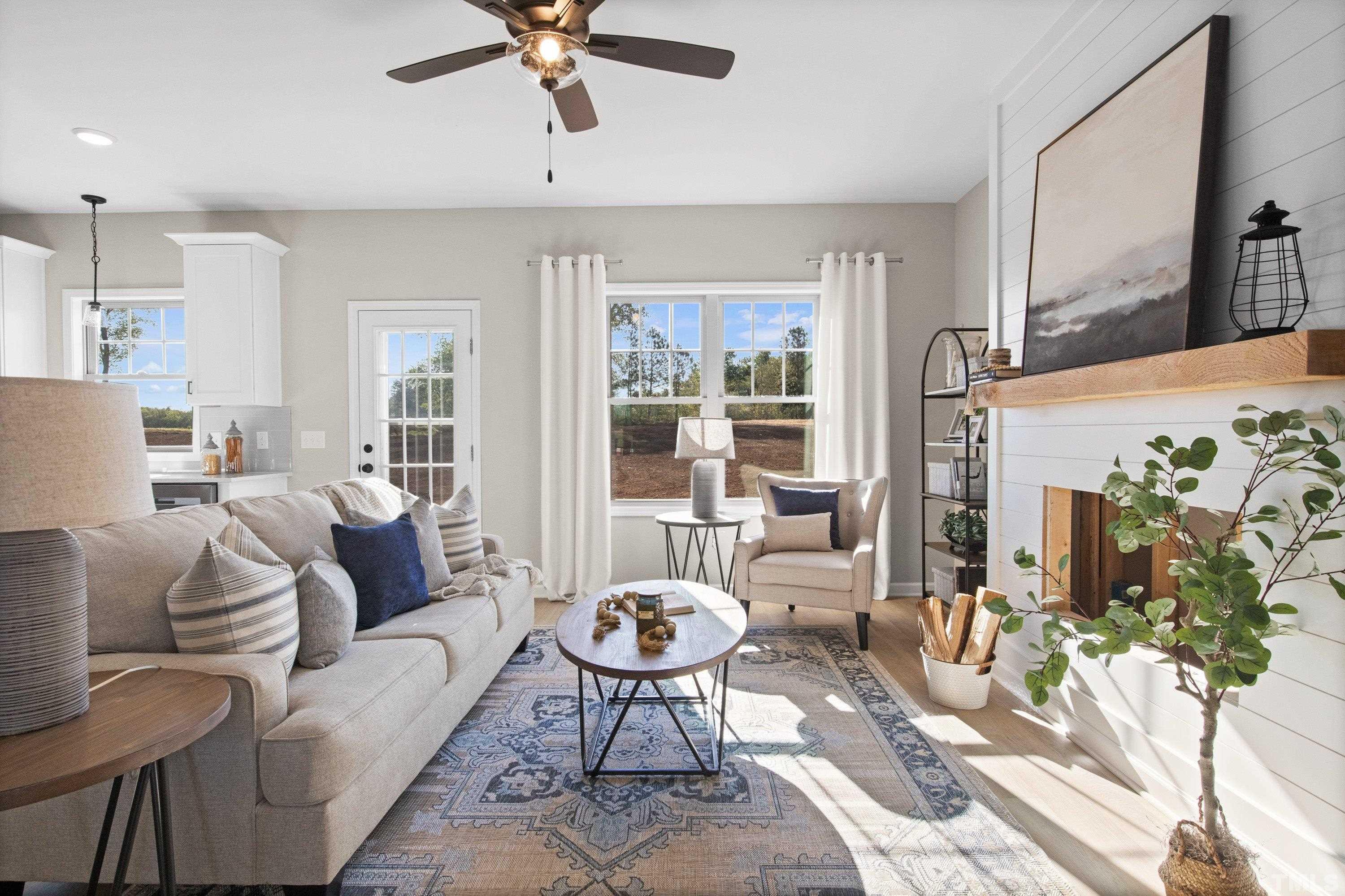 9765 Bear Run Lane Middlesex, NC 27557 - Photo 13 of 38 a living room with furniture and a flat screen tv