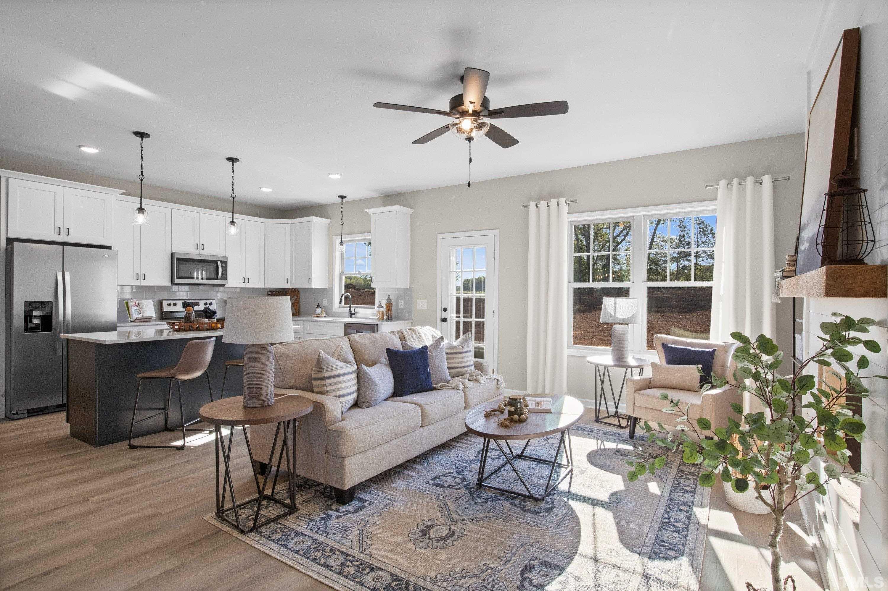 9765 Bear Run Lane Middlesex, NC 27557 - Photo 2 of 38 a living room with furniture kitchen and a window