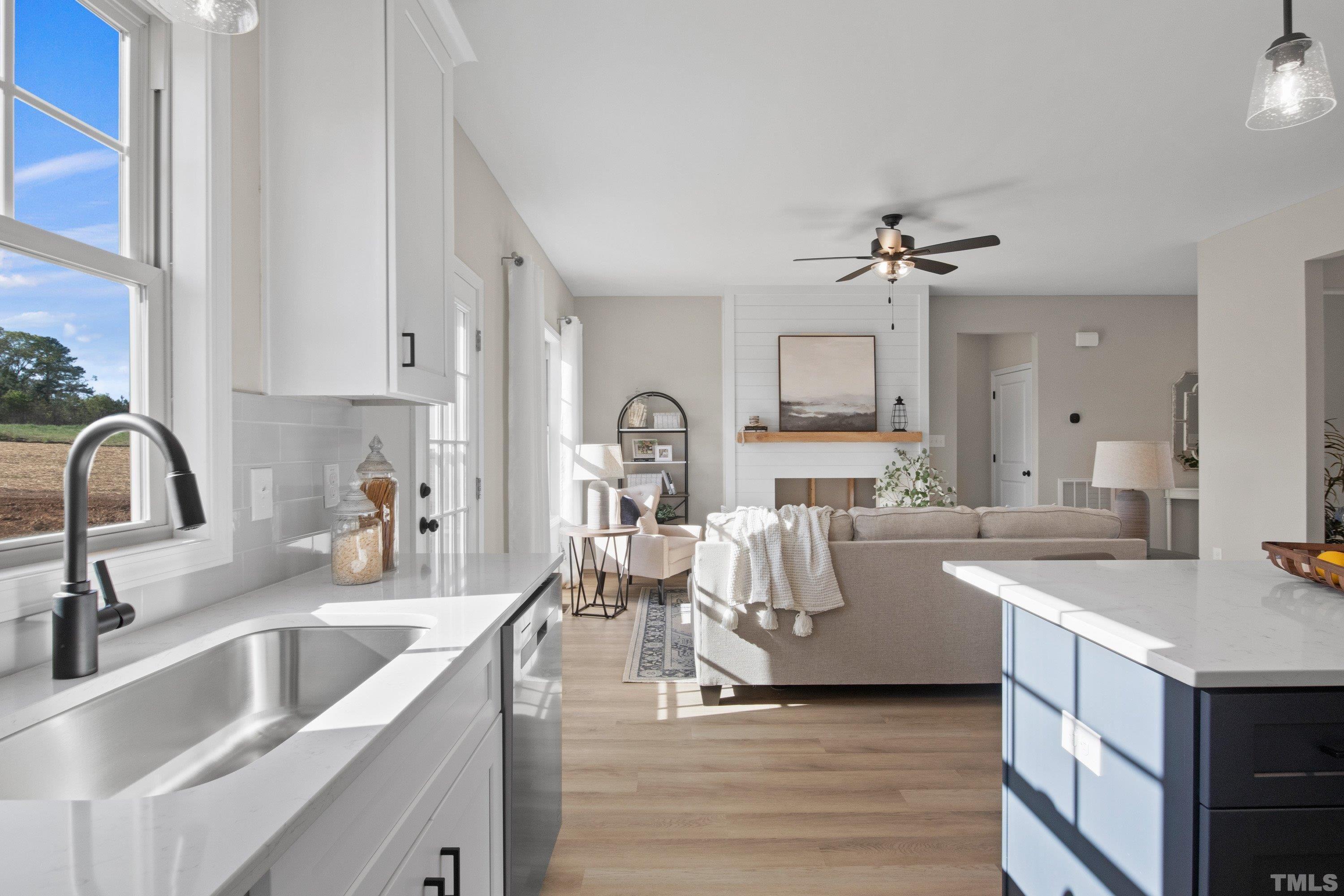 9765 Bear Run Lane Middlesex, NC 27557 - Photo 23 of 38 a view of a kitchen with a sink and fireplace