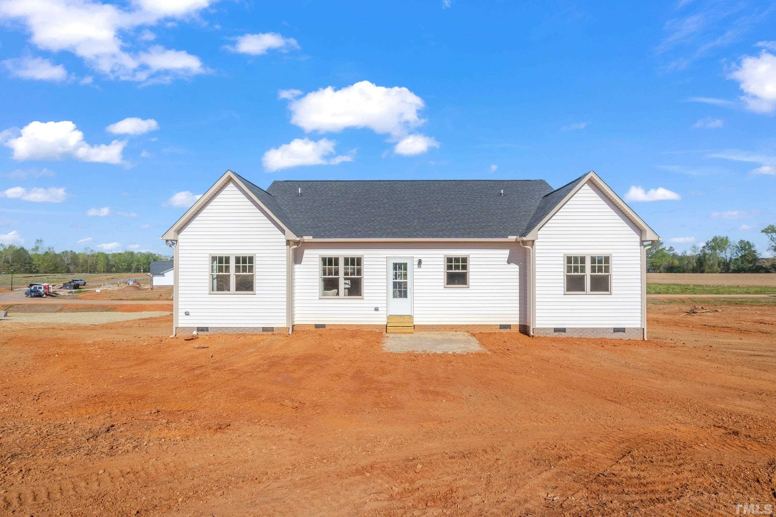 9765 Bear Run Lane Middlesex, NC 27557 - Photo 36 of 38 a view of house with yard and garage