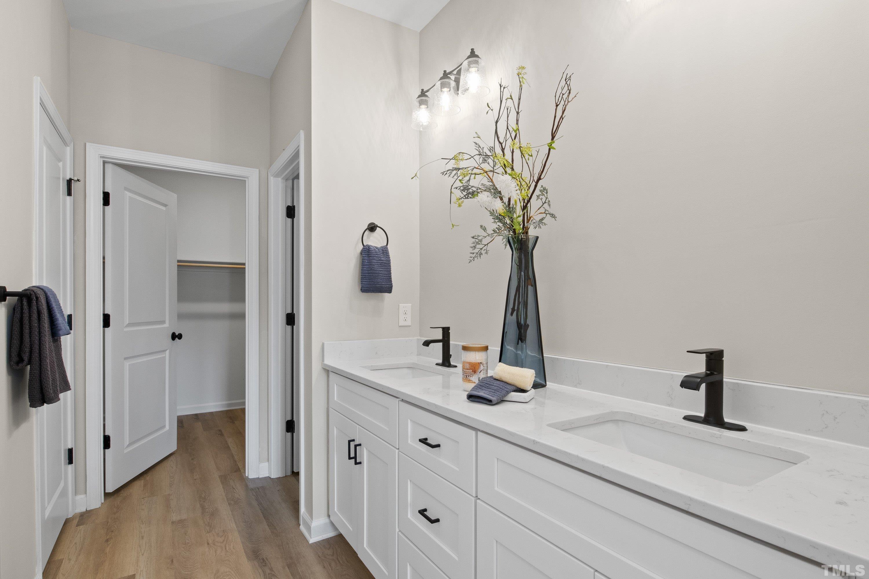 9765 Bear Run Lane Middlesex, NC 27557 - Photo 7 of 38 a bathroom with a double vanity sink