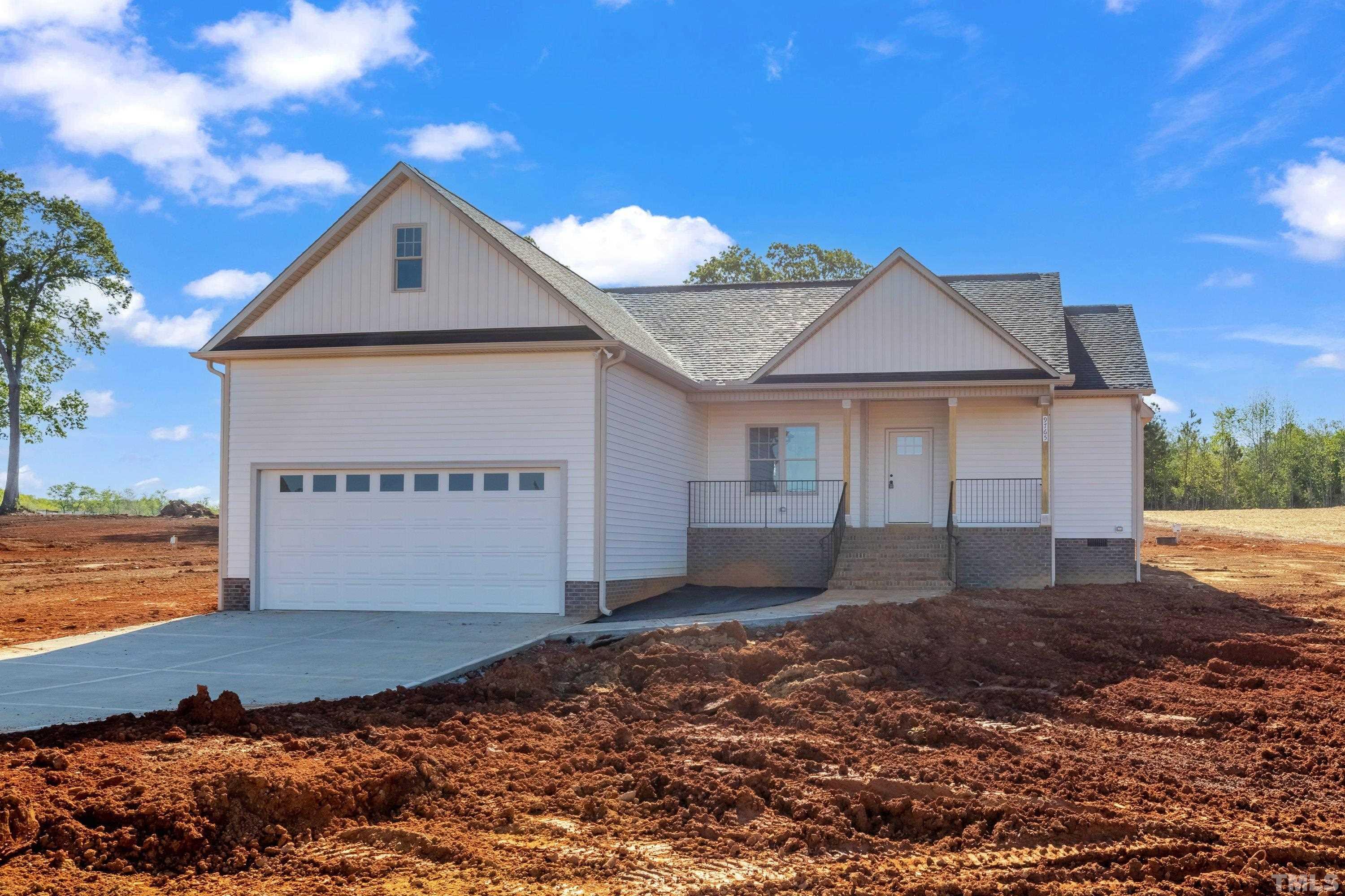 9765 Bear Run Lane Middlesex, NC 27557 - Photo 9 of 38 a front view of a house with a yard